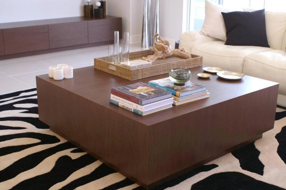Low square custom wood coffee table in a living room